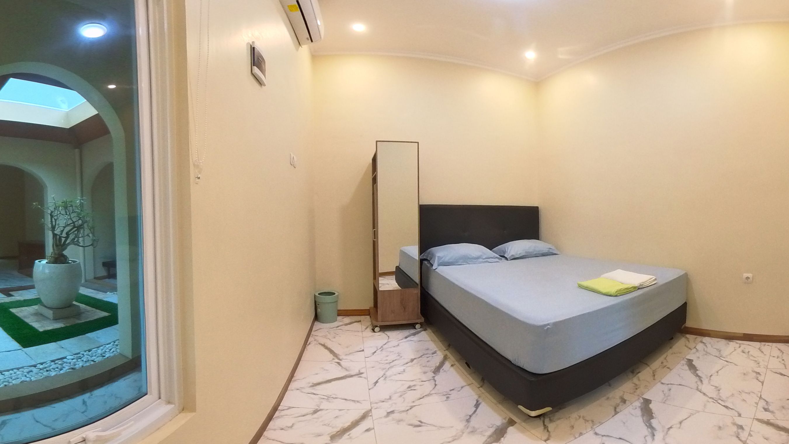 Foto Deluxe di Pomah Guesthouse Semarang